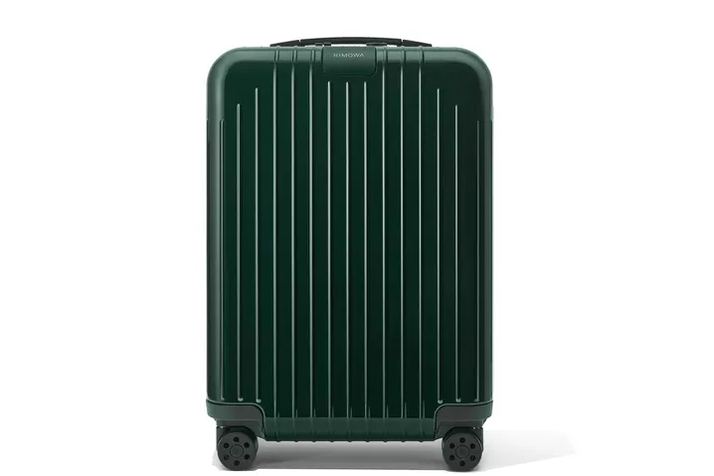 Travelpro Platinum Elite carry-on next to airport gate seating